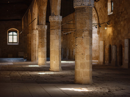 Rhodes, Greece - April 21, 2023: Ancient ruins in the Archeological Museum of Rhodes Town. beautiful old columns in the museum and sun lightのeditorial素材
