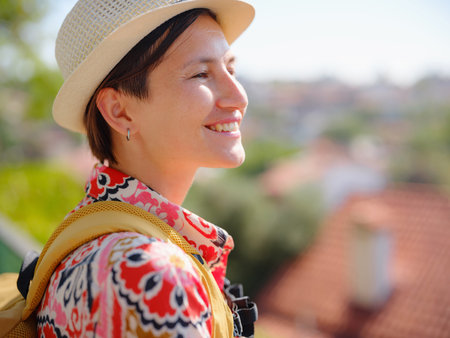 female summer travel to Antalya, Turkey. young Asian woman in red dress walk through old town Kalechi , Panoramic view of Antalya Old Town , old otoman housesの写真素材