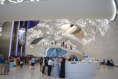Dubai, UAE - January 16, 2024: Entrance to the Museum of the Future, entrance hall interior with spiral stairs and tourists.のeditorial素材
