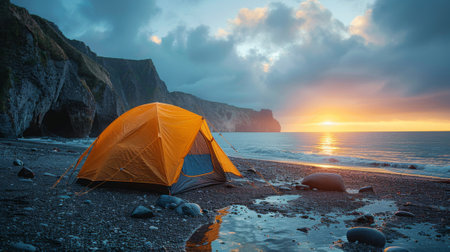 camp tent near sunset ocean, concept of summer vacation.の素材