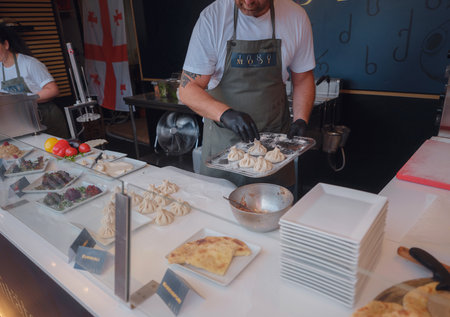 Vienna, Austria - July 17, 2023. Vienna Film Festival, Europe's largest culture, culinary festival. People enjoying movies and restaurants in Vienna's main square, Rauthausplatz by city hall.のeditorial素材