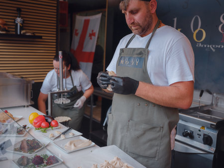 Vienna, Austria - July 17, 2023. Vienna Film Festival, Europe's largest culture, culinary festival. People enjoying movies and restaurants in Vienna's main square, Rauthausplatz by city hall.のeditorial素材
