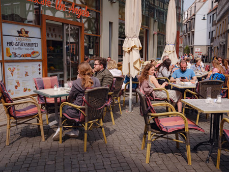 Erfurt, Germany - May 21, 2023: city street life in old town, historical heritage.のeditorial素材