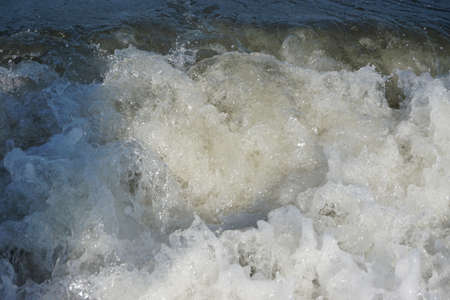 Summers day by the sea in Northern Britain.  Sea spray and wavesの写真素材