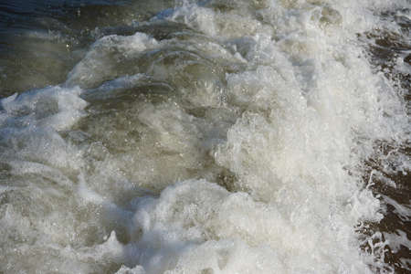 Summers day by the sea in Northern Britain.  Sea spray and wavesの写真素材