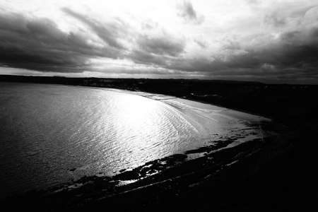Summers day by the sea in Northern Britain.  Sea spray and wavesの写真素材