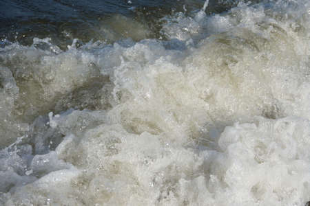 Summers day by the sea in Northern Britain.  Sea spray and wavesの写真素材