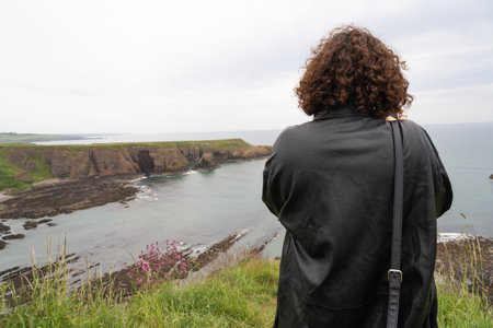 Beautiful woman contemplating the outsideの写真素材