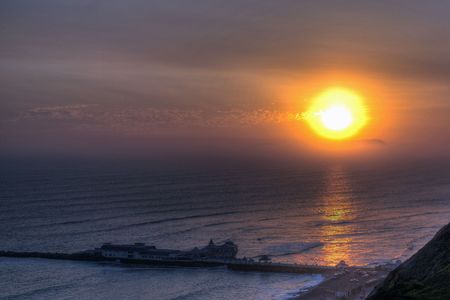 Sunset overlooking a Pier in Lima の写真素材