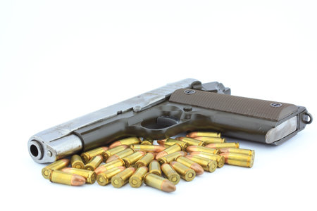 Handgun and bullets  on white background 