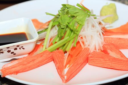 Crab-meat sticks on plate ready to eatの写真素材