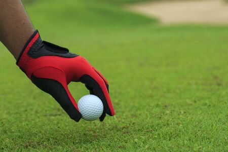 Close-up hand hold golf ballの写真素材