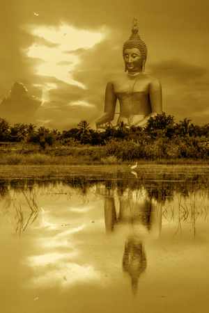 Vintage Big buddha statue in sunset at Angthong,Thailand の写真素材