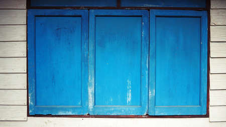 Old blue window in white background.の写真素材