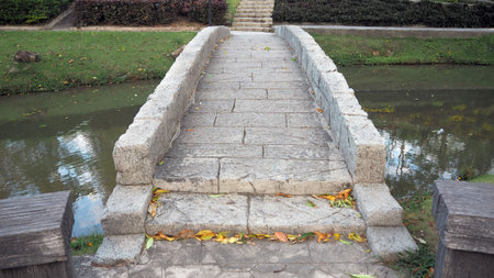 Bridge over the river made from rock in the countryside.