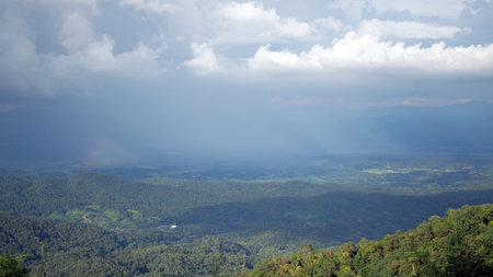 Landscape Mountain valley. Background blue sky with white full of rain clouds.