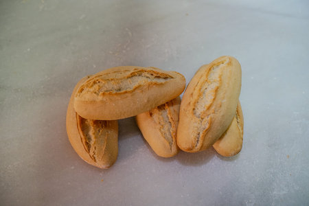 French baguettes on a white background. Selective focus.