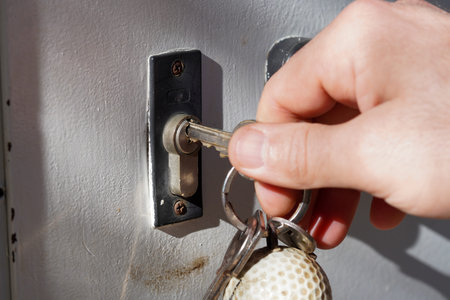 The key is inserted into the lock of the door. The key is inserted into the lock.