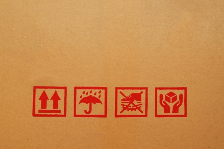 Black fragile symbol on cardboard boxの写真素材