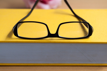 old book wirh glassesの写真素材