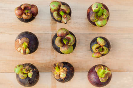 mangosteen fruit on wood tableの写真素材
