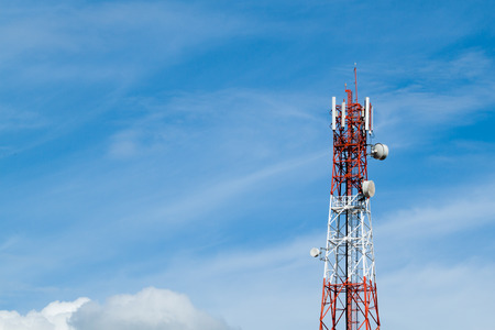 Telecommunication tower and blue skyの写真素材
