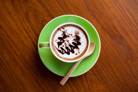 top view art hot coffee in green cupの写真素材