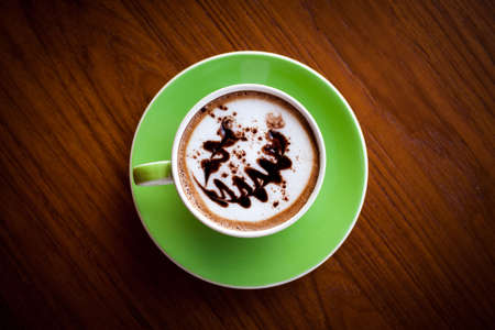 top view art hot coffee in green cupの写真素材