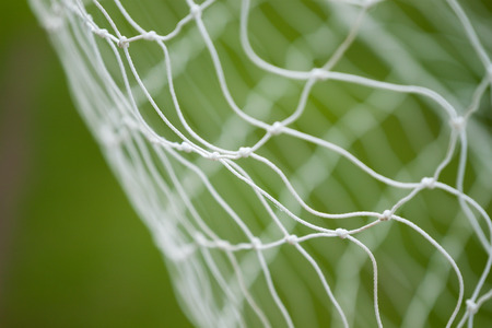 Detail of soccer net with defocused background.の写真素材