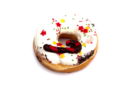 Donut with sprinkles isolated on whiteの写真素材