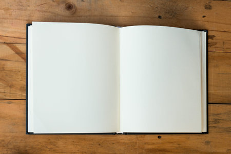 open book with blank pages on wood table