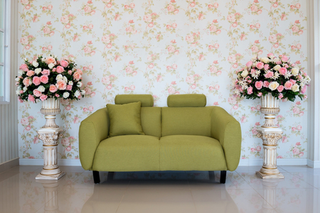 Classic living-room interior with green couch and flowerの写真素材
