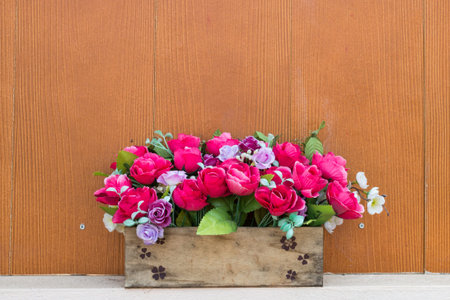 flower in bouquet with wooden wallの写真素材