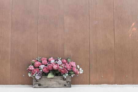 flower in bouquet with wooden wallの写真素材