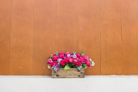 flower in bouquet with wooden wallの写真素材