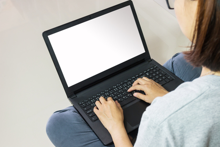 Close-up Of Young Woman Using Laptop On floorの写真素材