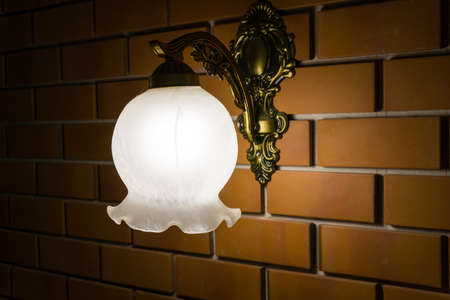 Vintage lamp on brick wallの写真素材