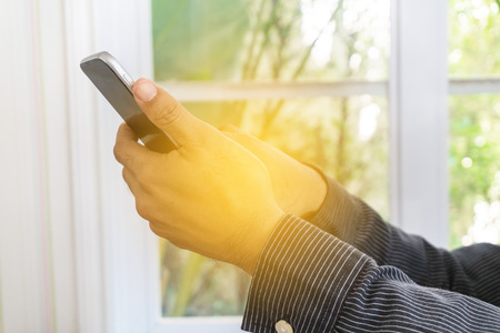 businessman use smartphone in officeの写真素材