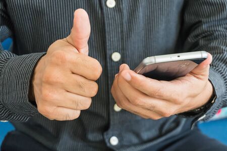 businessman use smartphone in officeの写真素材