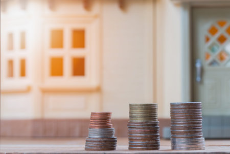 Mortgage concept by money house from the coinの写真素材