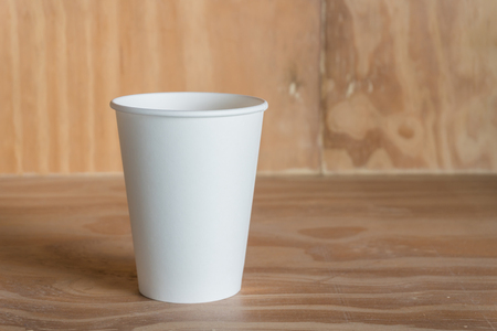 Paper cup on wood backgroundの写真素材