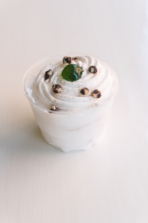 white cupcake on white tableの写真素材