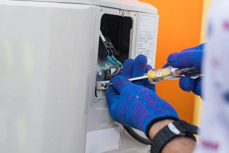 Technician repair and maintenance air conditionerの写真素材