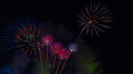Brightly colorful fireworks in the night sky. New Year celebration fireworksの写真素材
