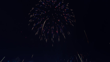 Brightly colorful fireworks in the night sky. New Year celebration fireworksの写真素材
