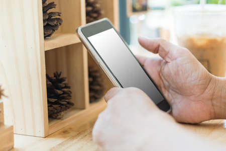 business woman use smart phone in coffee shopの写真素材