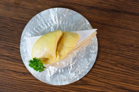 fresh  durian on Durian cake on brown wooden backgroundの写真素材