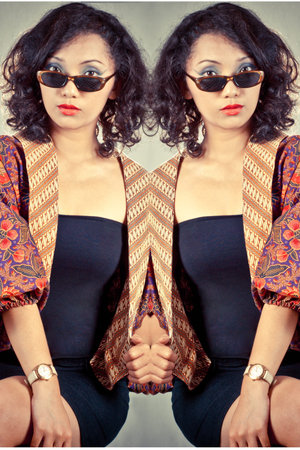 Portrait asia girl with curly hair wearing traditional regional costumes from Indonesia 