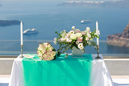 Table and decorations for the wedding ceremony on the beach. Greece, Santorini.の写真素材