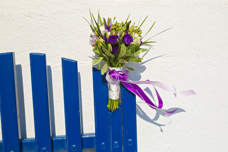 Wedding bouquet in blue tones against a white wallの写真素材